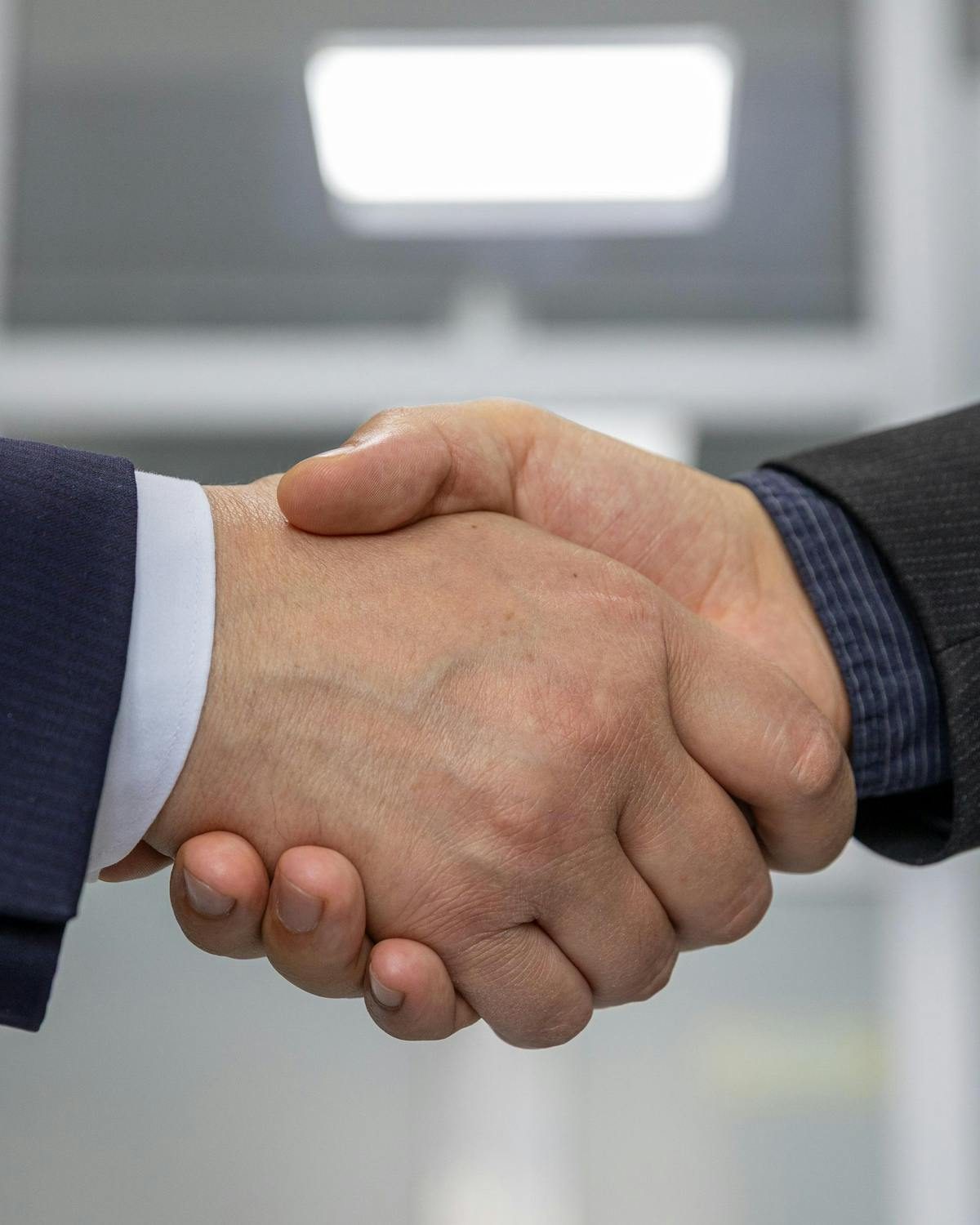 Apretón de manos de socios — fusiones y adquisiciones (M&A)